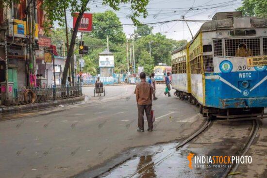 Ancient Kolkata tramway with early morning city road