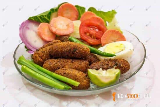 Crispy fried fish fingers served with salad