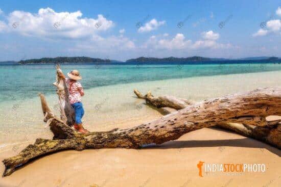 Female tourist at Jolly Buoy island sea beach at Andaman