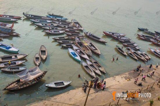 Ganges riverbank Varanasi with wooden boats in aerial view