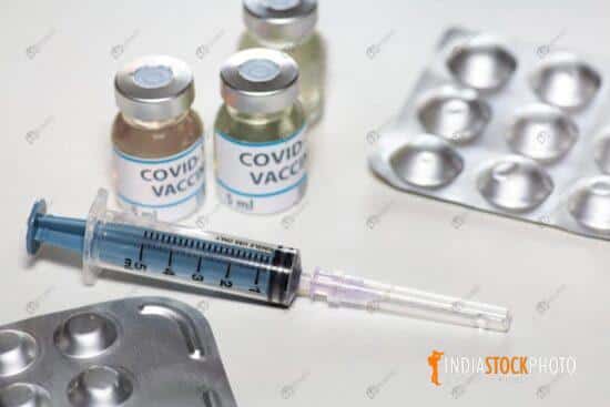 Injection syringe vaccine bottles with medication drugs for Coronavirus treatment