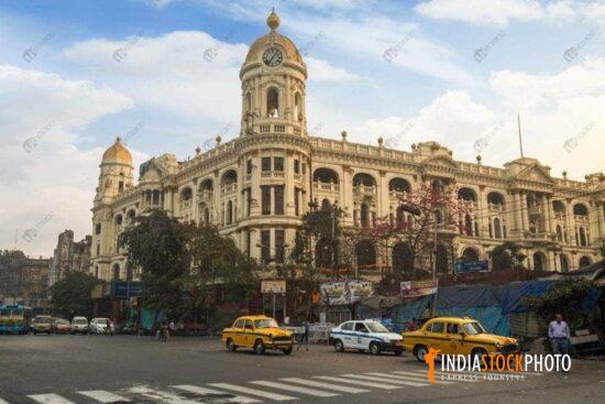 Metropolitan heritage building with city road crossing at Kolkata