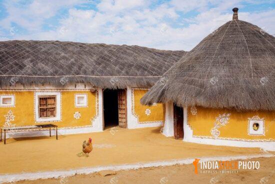 Rural village with mud huts and thatched roof at Jaisalmer Rajasthan