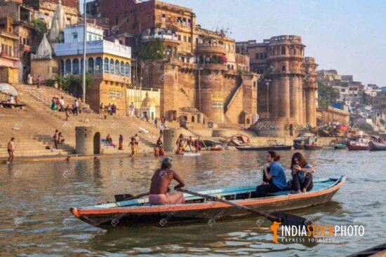 Female tourists enjoy boat ride at Varanasi Ganges