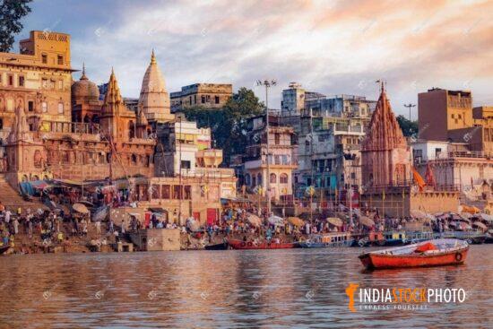 Varanasi ancient city architecture on the Ganges riverbank at sunset