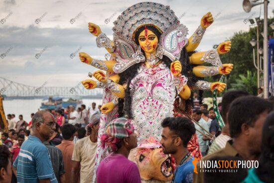 Durga idol immersion at Ganges river Babughat Kolkata
