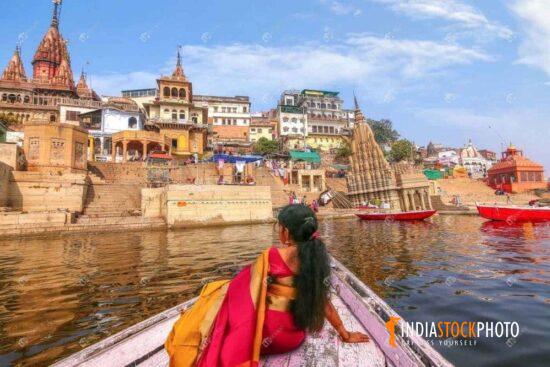 Woman enjoy boat ride at Varanasi Ganges river