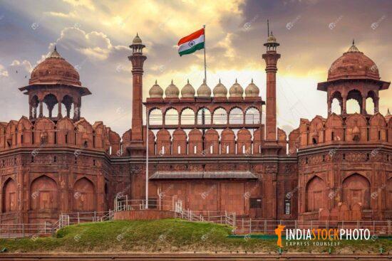 Historic Red Fort Delhi at sunset with Indian tricolor