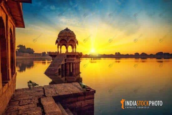 Gadi Sagar lake with ancient architecture ruins at sunrise at Jaisalmer
