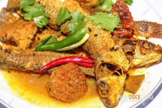 Traditional Indian fish curry food served with rice