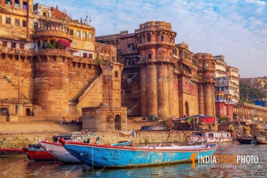 Historic Varanasi city architecture with boat on river Ganga