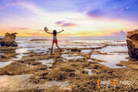 Girl enjoying beach sunset at Neil Island India