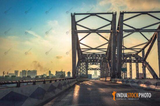 City flyover over bridge with Kolkata cityscape at sunrise