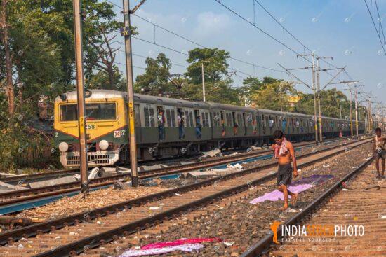 Indian Railways local passenger train with train tracks
