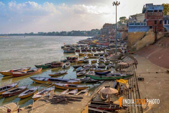 Varanasi aerial Ganges riverbank with wooden boats and city architecture