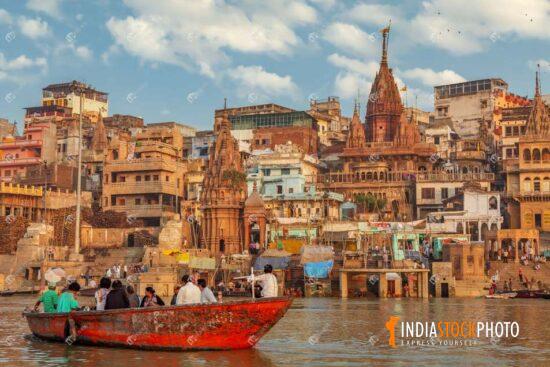 Varanasi historic city with tourist boat on river Ganges