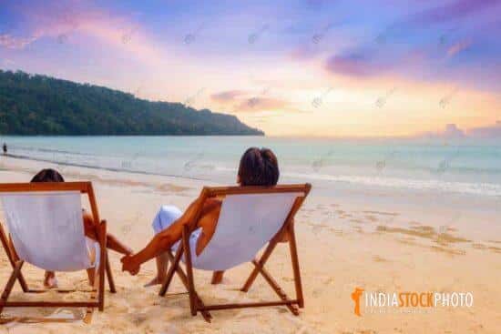 Couple enjoy sunset at Havelock island at Andaman