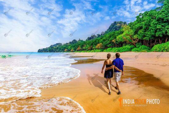 Honeymoon couple enjoy walk at Havelock Islands at Andaman