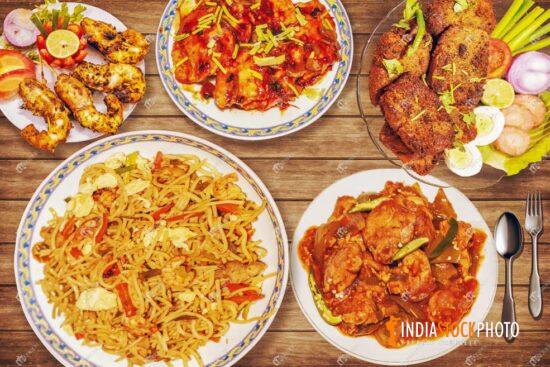 Indian food of mixed hakka chowmein with spicy chili chicken and fried prawn
