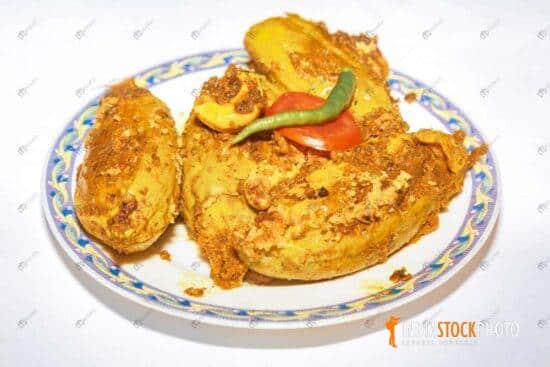 Spicy Indian food prepared with pointed gourd stuffed with fish