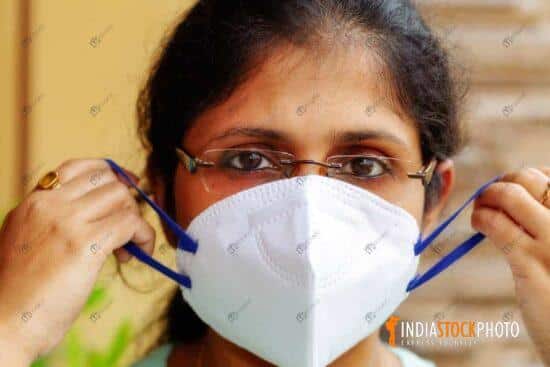 Indian woman wearing a N95 face mask for Covid-19 prevention
