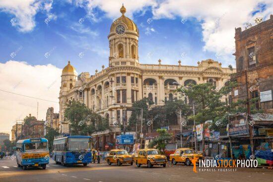 Old colonial city buildings with public transport on city road at Kolkata