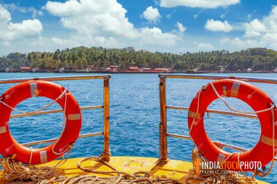 Speed boat railings with life buoy at Andaman sea