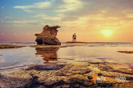 Tourist couple at rocky sea beach Neil island at Andaman