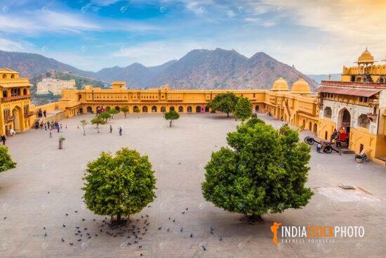Amber Fort Jaipur aerial view of open courtyard with Aravalli mountain at sunrise