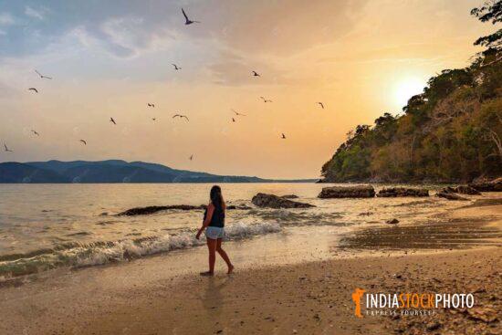 Female tourist at Chidiya Tapu sea beach Port Blair Andaman at sunset