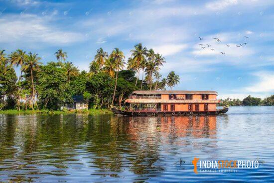 Kerala backwater with tourist houseboat