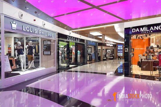 Modern city shopping mall interior with brand retail stores