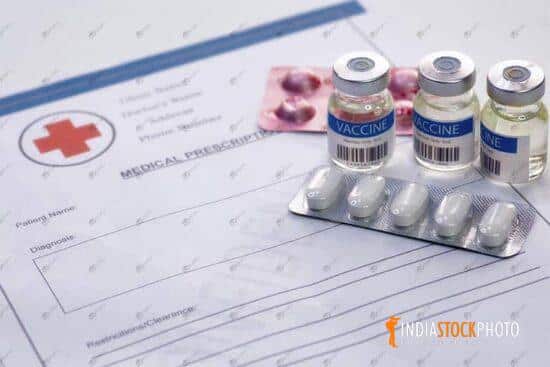 Medical prescription report with vaccine bottles and medicine
