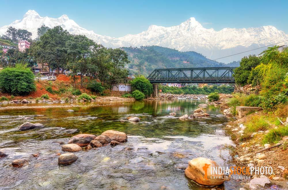 Bridge on Gomti river with scenic Himalaya mountain landscape at Uttarakhand