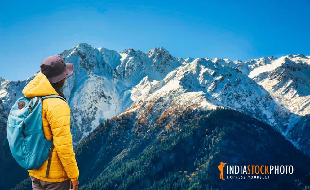 Tourist hiker enjoy view of Himalaya mountain range at Kalpa Himachal Pradesh